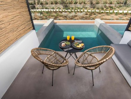 Private Pool Deluxe Room with outdoor seating and private pool in the Cyclades. Perfect for a luxuri.