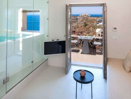 Elegant Junior Cave Suite with sea view and jetted tub in Cyclades. Perfect for a luxurious stay at.