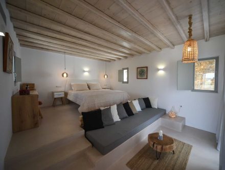 Deluxe suite with jetted tub, pool view, and modern decor at Mr and Mrs White Hotels Cyclades. Perfe.