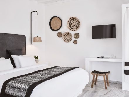 Cozy double room with mountain view, modern decor, and minimalist design in Cyclades. Perfect for a.