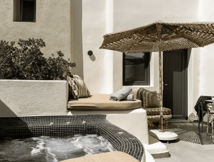 Junior suite with jetted tub and outdoor seating at Mr and Mrs White Hotels Cyclades.